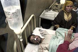 One of the persons injured in a grenade blast at Beijbehera at a hospital in Srinagar