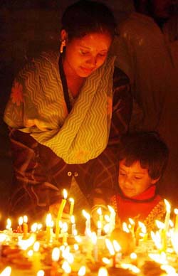 A child celebrates Divali with her mother in Srinagar on Saturday
