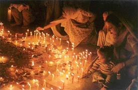 Children light candles on Divali at Gurdwara Singh Sabha