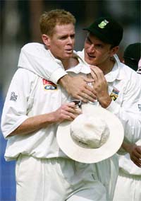 South African skipper Graeme Smith and Shaun Pollock leave the field in Faisalabad 