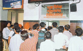 Passengers, who were stranded due to disruption of rail traffic at the Jammu-Pathankot section, at the enquiry counter of the Ludhiana railway station