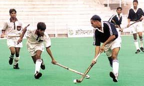 Players vying for the ball during a match between junior hockey team Delhi vs Jalandhar in the Nehru Hockey Tournament in the Capital on Monday. 