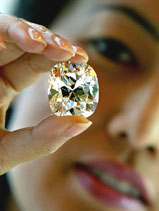 A staffer holds the largest D colour diamond for auction offered by Sotheby's in Hong Kong 