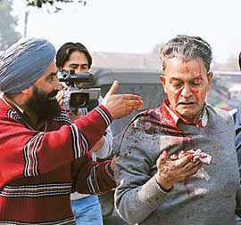 A grenade blast victim being taken to hospital