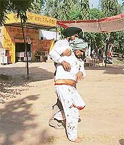 Mr Bant Singh, a middle-aged farmer of Khanpur, is carried off National Highway 64 at Ganda Kherri