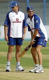England captain Michael Vaughan bats as Marcus Trescothick looks on 
