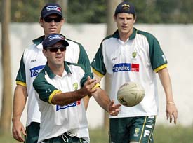 Australian cricket captain Ricky Ponting throws a rugby ball 