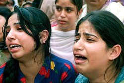 Two girls mourn the death of their relatives who were killed when holed-up militants exchanged fire with the security forces in Akhnoor village near Jammu on Tuesday night.