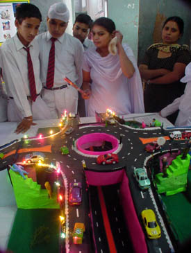 A government school student explains her model on automatic bypass for VIPs and ambulances during the district-level science exhibition organised at Ramgarhia Senior Secondary School for Boys
