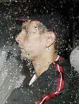 England and Manchester United defender Rio Ferdinand leaves his home near Manchester on Wednesday