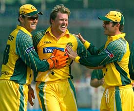 Australia�s Brad Williams celebrates with Adam Gilchrist and Damien Martyn after taking the wicket of New Zealand�s Scott Styris in the third one-day match