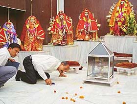 A forensic expert, Mr G.R. Jain, looks for clues at Pracheen Shiv Mandir, Panchkula