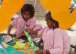 Children prepare colourful buntings ahead of Prince Charles's visit
