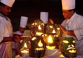 Ghoulish-looking pumpkins being readied for Halloween party at a hotel