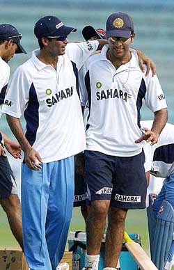 Mohammad Kaif and team-mate Yuvraj Singh share a light moment during a pratice session at Wankhade Stadium
