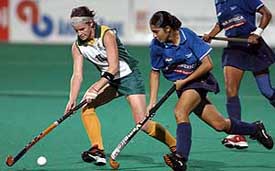 Jasjeet Kaur dribbles past Kerry Bee of South Africa in the hockey final