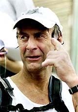 British explorer Sir Ranulph Fiennes speaks to the media after he finished a marathon run