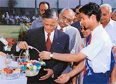 Mr Sudarshan Agarwal, Governor of Uttaranchal, takes a view of artificial flower arrangements exhibited by the students
