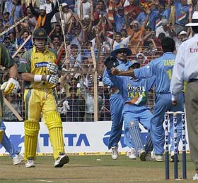 Australian opener Mathew Hayden walks back after being dismissed by Zaheer Khan 