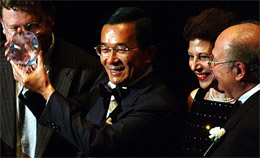 Taiwan President Chen Shui-bian holds up the 35th annual International Human Rights Award after receiving it in New York 