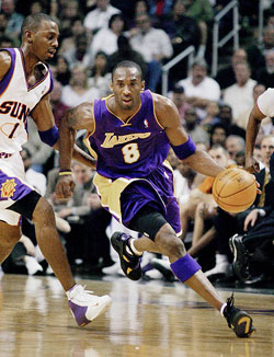 Los Angeles Lakers guard Kobe Bryant drives past Phoenix Suns guard Anfernee Hardaway
