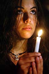 An Israeli woman holds a candle during a memorial ceremony