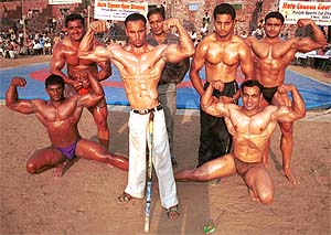 Polio-affected Hira Singh of Moga is all muscles as he joins bodybuilders from other parts of north India at the inaugural Mata Chanan Kaur Dhanoa Rural Sports festival 