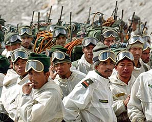 Soldiers of the Indian Army muster at their base camp after returning from training at Siachen