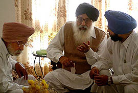 Mr Parkash Singh Badal, President, Shiromani Akali Dal, discusses something with his brother, Mr Gurdas Badal, after a meeting with the party MLAs, MP and other senior leaders
