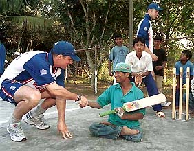 Visiting England cricketer Anthony Mcgrath shakes hand with a physically challenged boy at Sripur Childrens Home