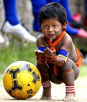 A child from Kayapo's nation plays with a ball during the VIth Indigenous Nation's Games in Palmas, northern Brazil