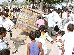 Municipal Council staff remove illegal khokhas from near Phase VI, SAS Nagar, on Wednesday.