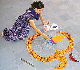 A girl make rangoli during the youth festival being held at the National Institute of Nursing Education at PGIMER, Chandigarh, on Wednesday.