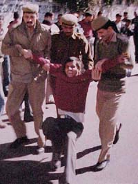 The police forcibly removes an agitator from outside the HP Secretariat