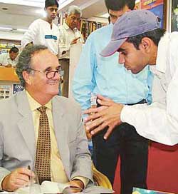 Former BBC correspondent for India Sir Mark Tully interacts with a reader at Capital Book Store, Sector 17