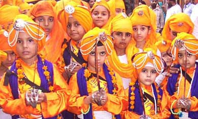 Children take part in nagar kirtan to mark gurpurb in Chaura Bazar