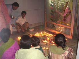 Devotees at a local temple on Wednesday night offer prayers