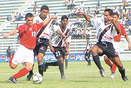 A keen tussle between Air India (in red) & Vasco Club during the Durand Cup Tournament in the Capital on Thursday.