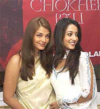 Bollywood actress Aishwarya Rai and Raima Sen at a press conference after a screening of their film, "Chokher Bali", in Mumbai