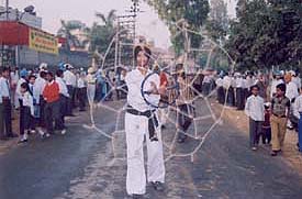 A Sikh boy displays gatka skills