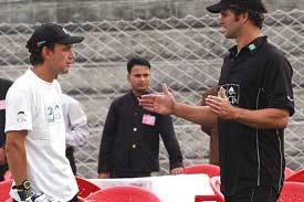 New Zealand allrounder Cris Cairns having discussion with Krist Nevin