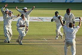 Zimbabwean players celebrate the dismissal of West Indies batsman Corey Collymore 
