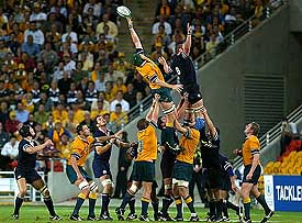 Scotland's Jason White reaches for a line-out ball with Australia's Justin Harrison during their Rugby World Cup quarterfinal match in Brisbane