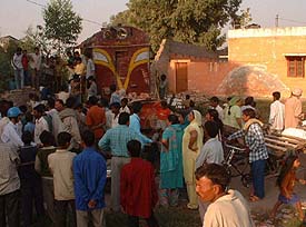 Residents of Manjit Nagar and Fauji Mohalla look at a diesel locomotive that went out of control during a trial run in Ludhiana