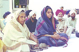 Delhi Chief Minister Sheila Dikshit listening to the �Gurbani Shabad� recital, organised at her residence in the Capital on Sunday.