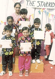 Little Balloons Nursery schoolkids with their prizes.