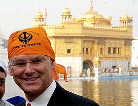 Mr Gorden Campbell, Premier of British Columbia, comes out of the Golden Temple after paying obeisance 