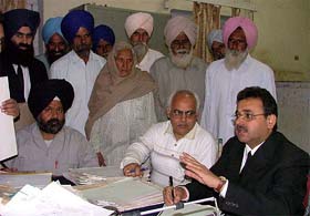 Mr Rajiv Malhotra, Civil Judge, makes a point during a Lok Adalat organised in Bathinda