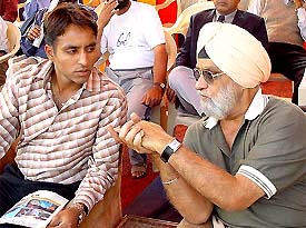 Indian hockey star Gagan Ajit Singh and former Indian cricket captain Bishen Singh Bedi share their experiences during the diamond jubilee celebration of Sansarpur Hockey Association 