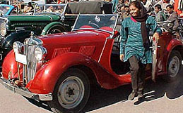 Tourists have a feel of vintage cars lined up on The Ridge in Shimla